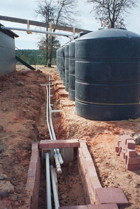 Our rainwater system during construction. Later we buried the piping to protect from freeze damage.