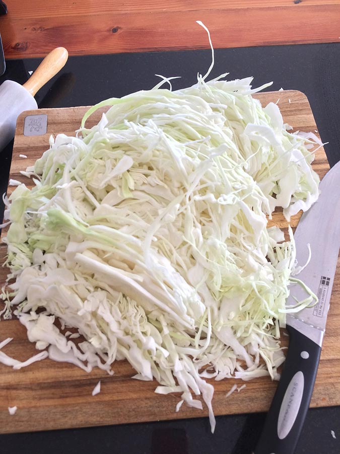 There's no magic to slicing cabbage for savory homemade sauerkraut. (The Grow Network)