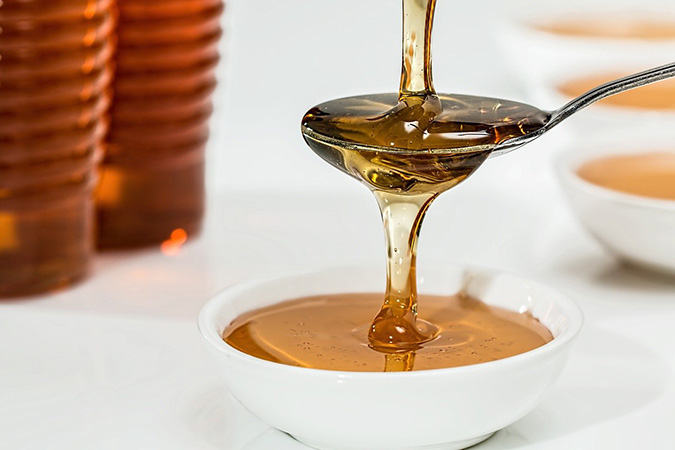 Make an electuary more palatable with raw honey. (The Grow Network)