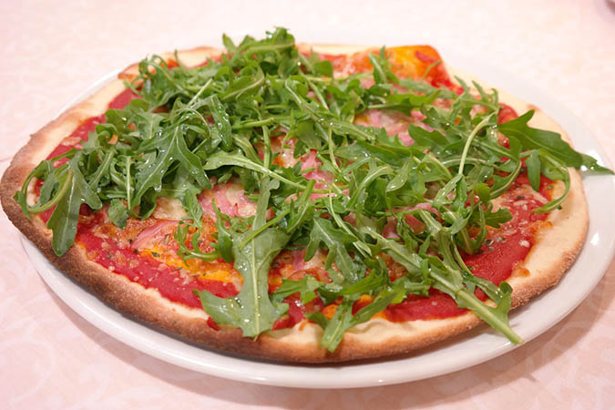 There are many uses for arugula, including as a topping for pizza (The Grow Network)