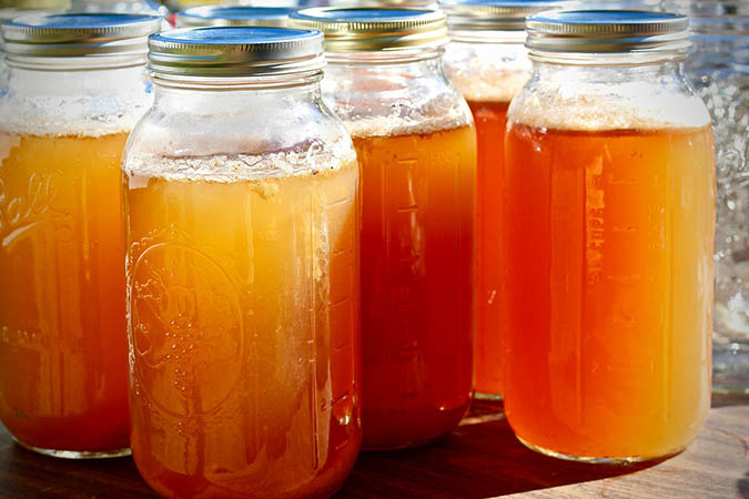 Homemade apple cider vinegar in jars (The Grow Network)